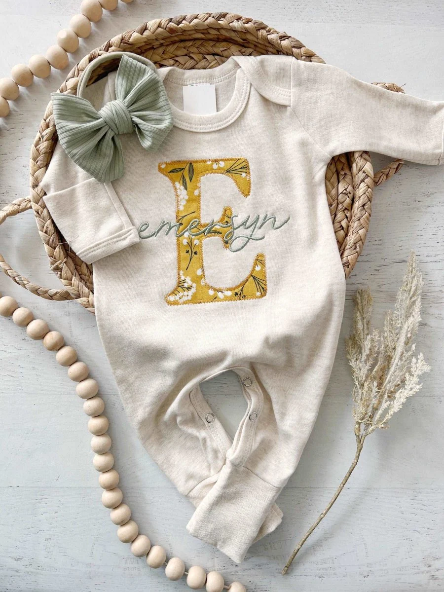 Dress the little one in style with a monogrammed onesie set