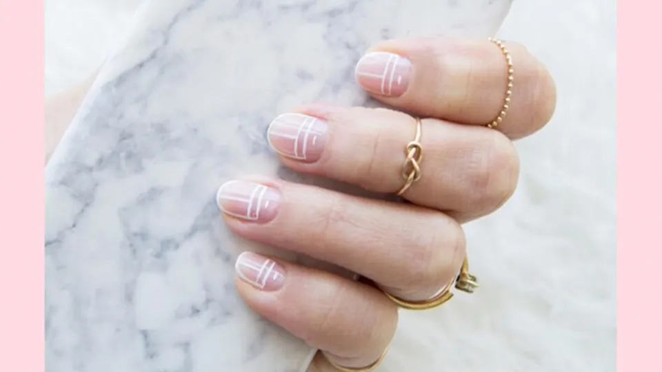 Master the art of negative space with partially unpainted nails or intricate cutouts