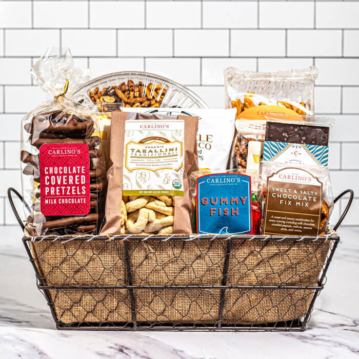 Curate a basket of high-quality, artisanal foods such as exotic spices, unique sauces, and specialty snacks