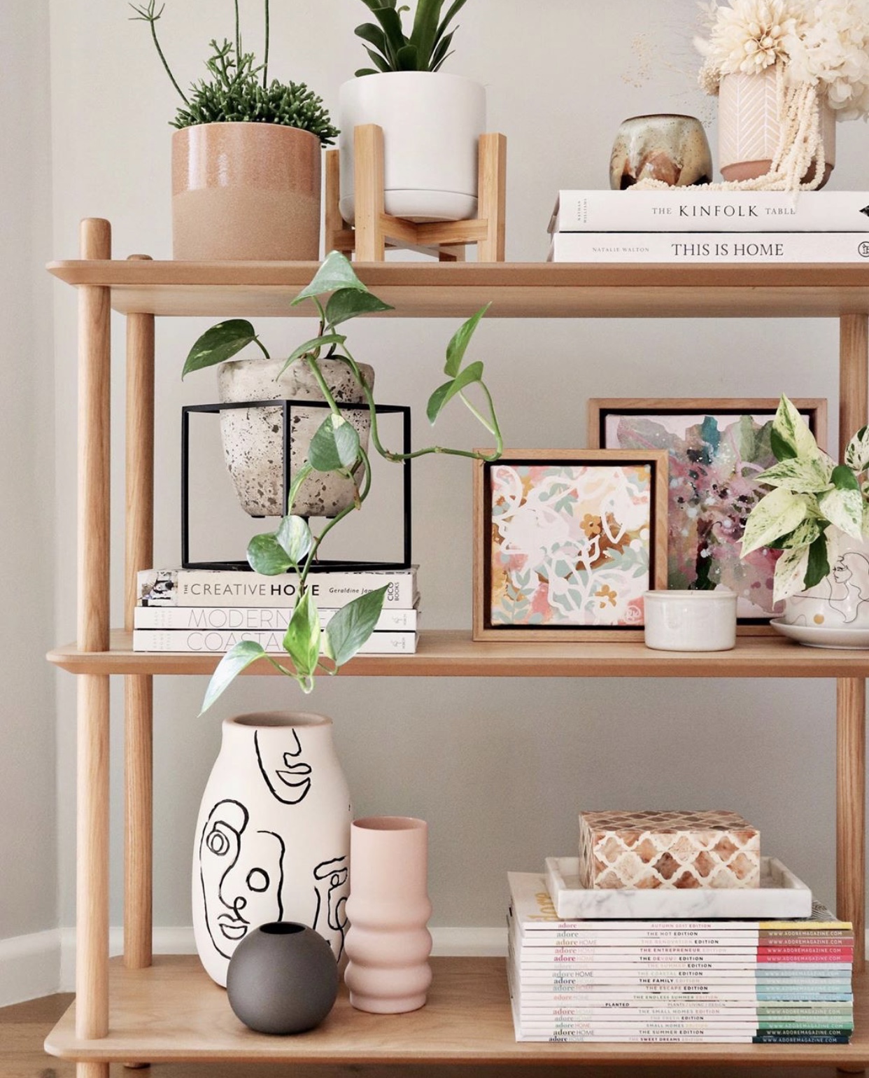 a wodden shelf with decorated items